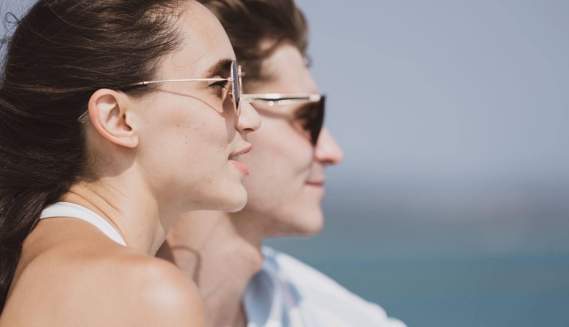 Couple enjoying the scenery during a self-drive boating experience on Lake Como.